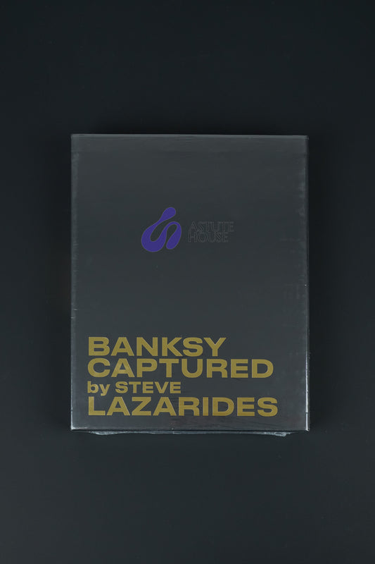 Black slipcase of the Banksy Captured book with gold foil details, a must-have for Banksy collectors.