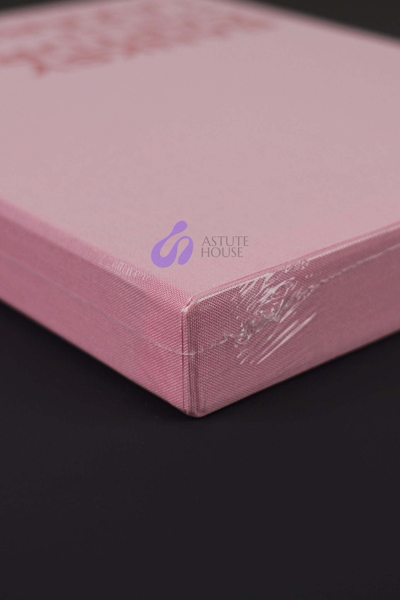 Close-up of the bottom corner of Banksy Captured Volume 2 slipcase, emphasizing its sturdy design and vibrant color.