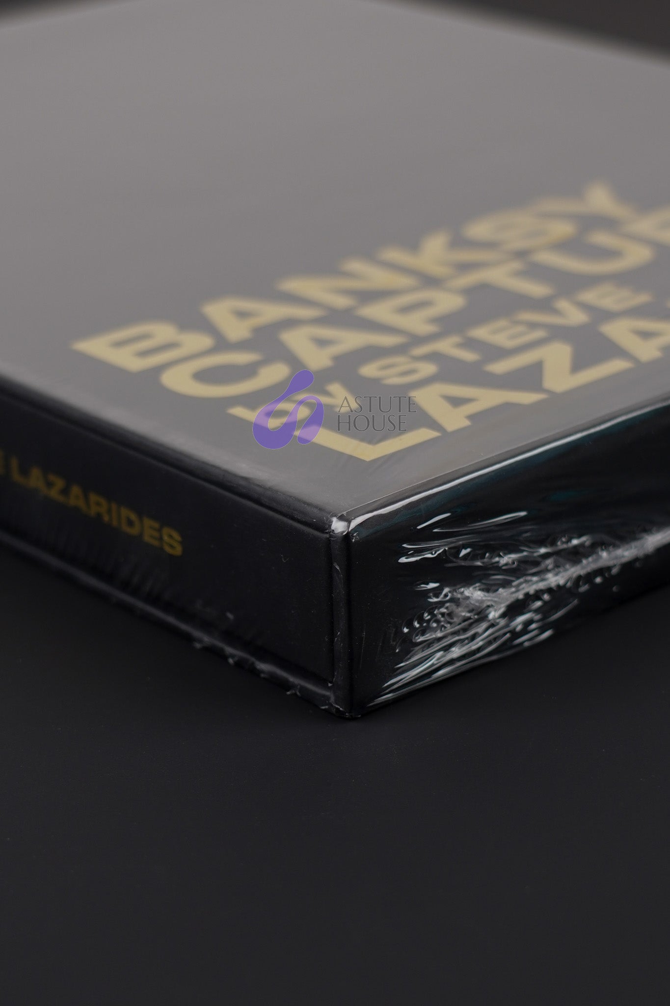 Close-up of the top corner of the Banksy Captured black slipcase, emphasizing its sharp edges and quality.