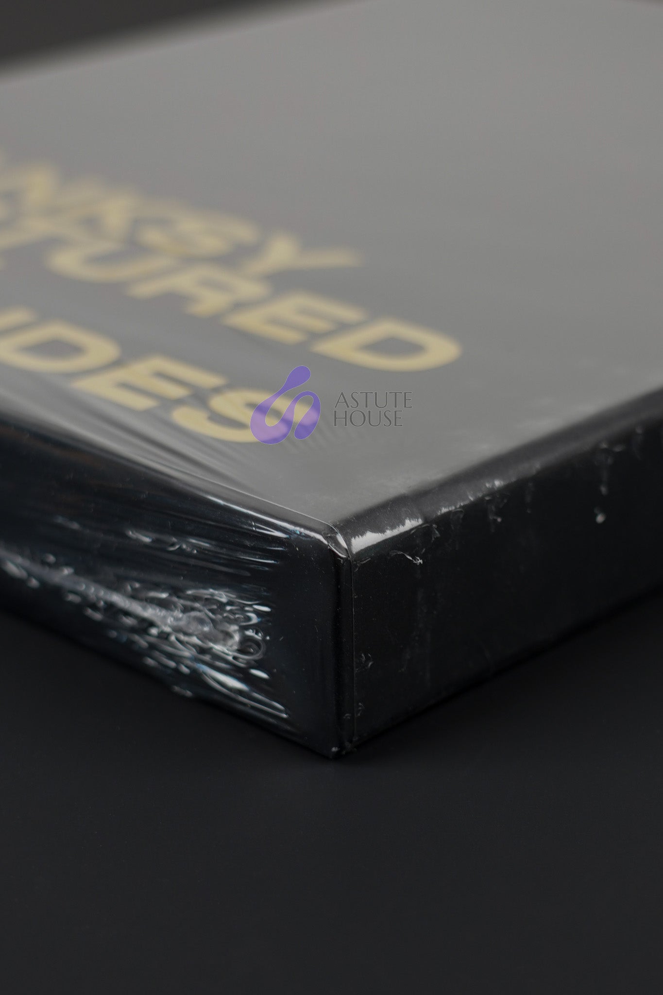 Close-up of the bottom corner of the Banksy Captured black slipcase, emphasizing its sharp edges and quality.