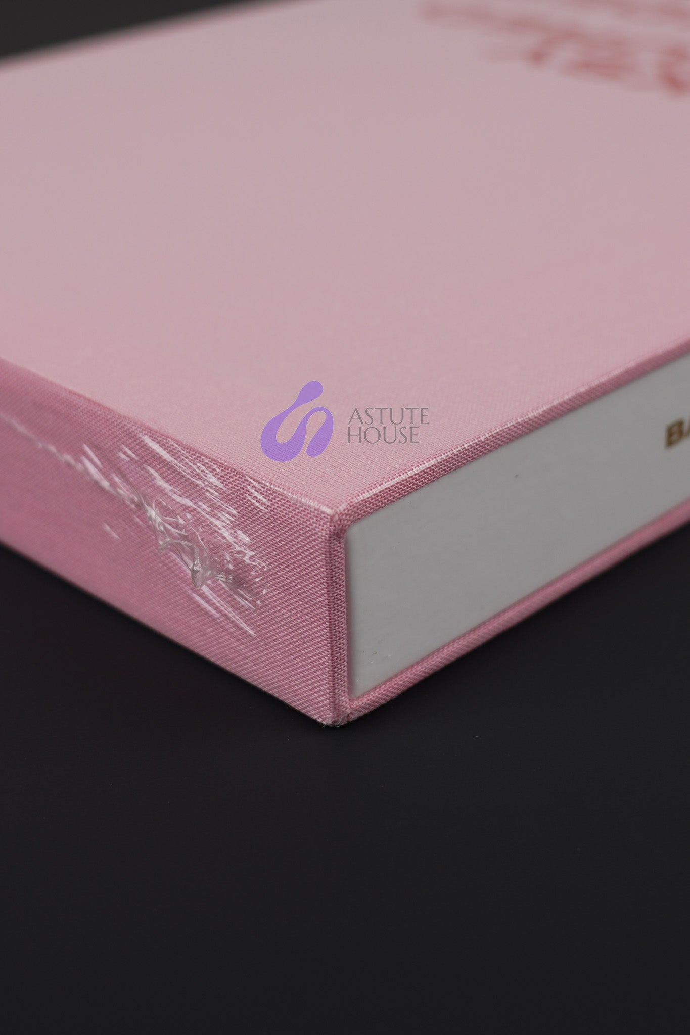 Close-up of the bottom corner of Banksy Captured Volume 2 slipcase, emphasizing its sturdy design and vibrant color.
