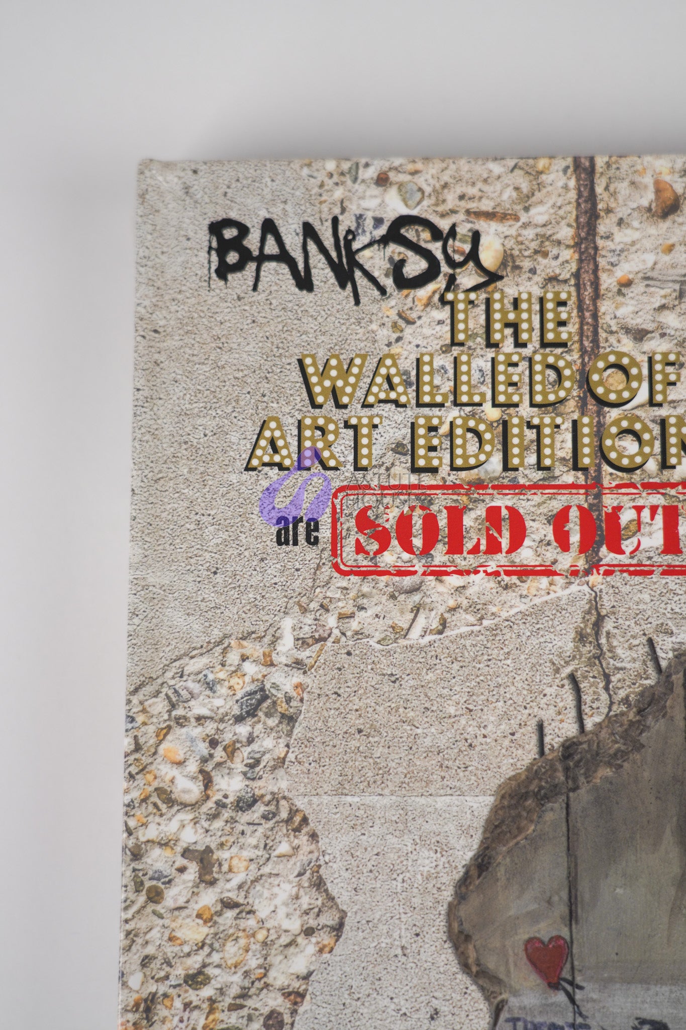  Close-up of the title on the front cover of "Banksy: The Walled Off Art Editions Are Sold Out" by Marc Pairon, highlighting typography details
